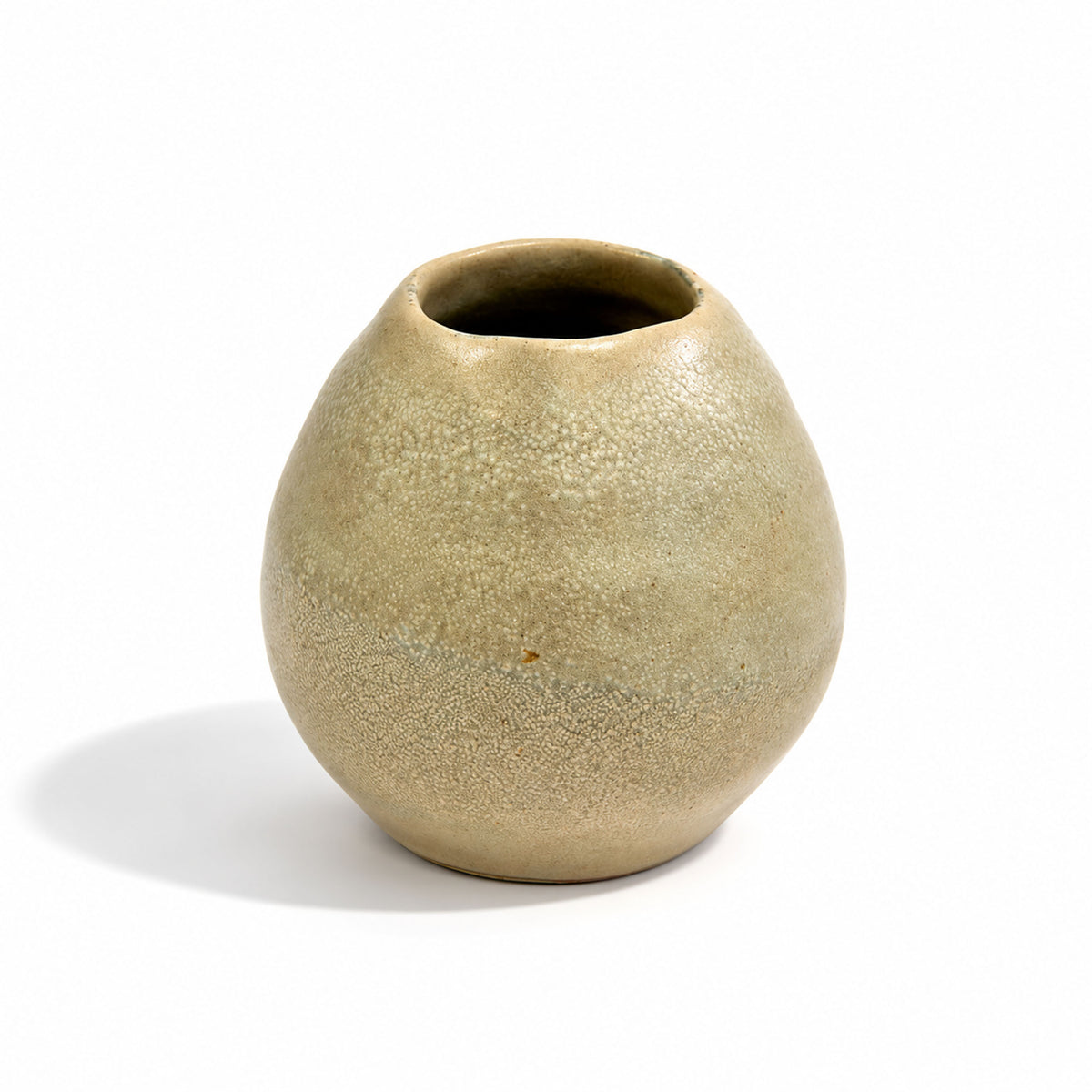 A small rounded ceramic vase with a textured, speckled glaze in a muted beige-clay colour, shown on a white background with a soft shadow.