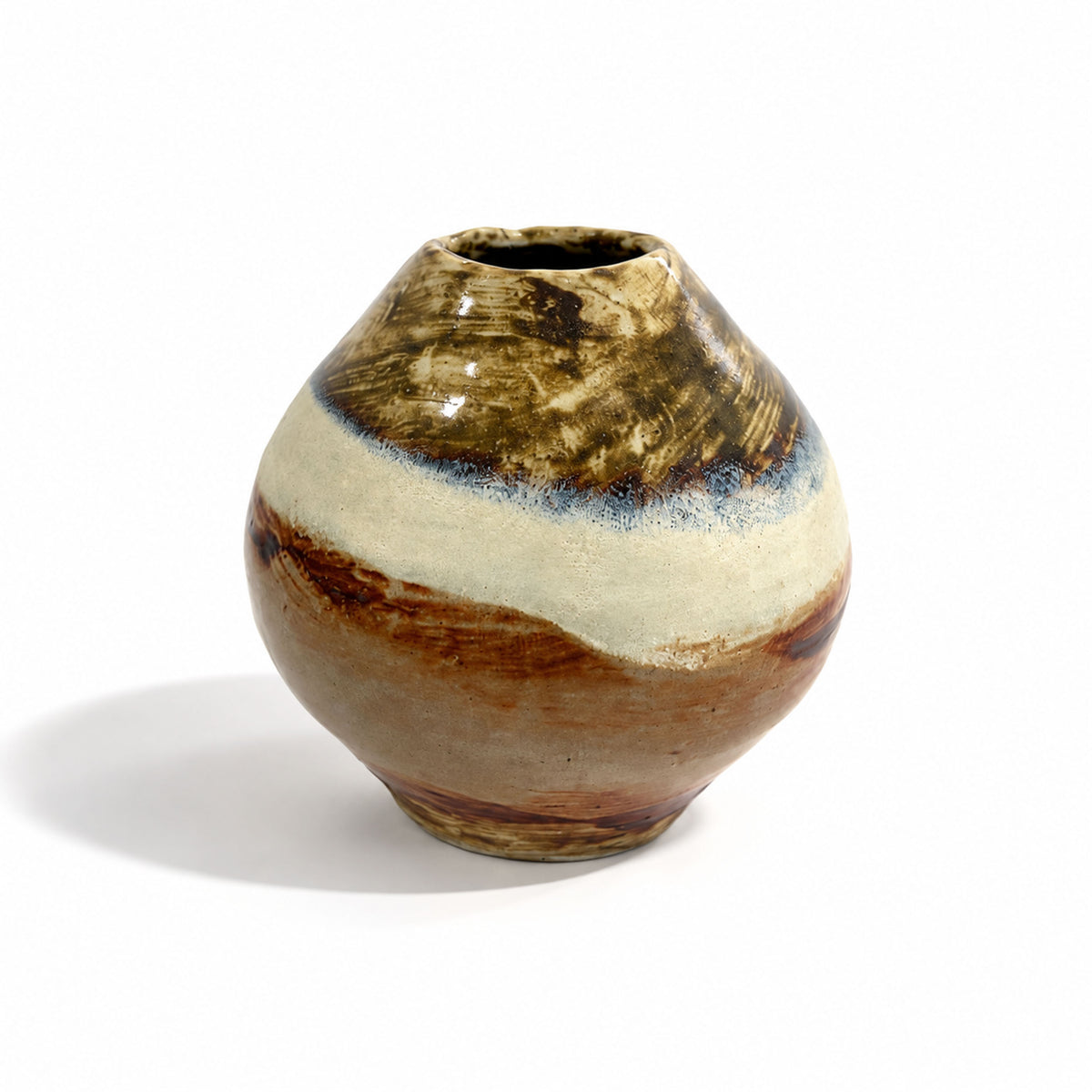 A handmade ceramic vase with a rounded bulbous body and a narrow conical neck, featuring a rustic glaze with brown, beige, and blue tones, photographed on a white background with a soft shadow.